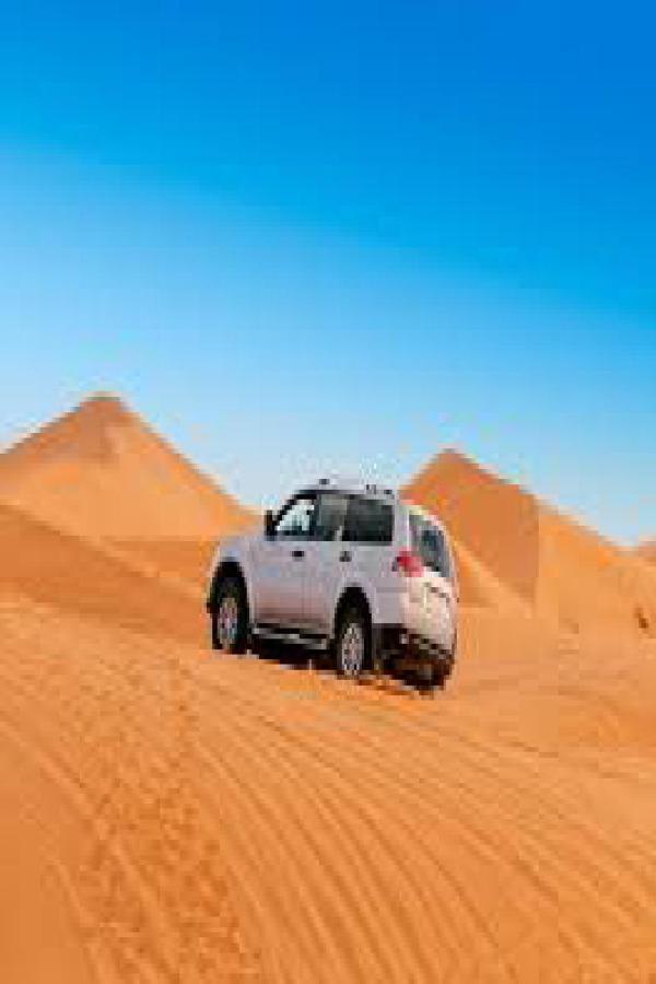 Les Pyramides Hotel Merzouga Bagian luar foto